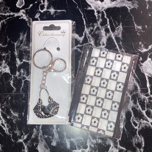 Silver and black purse charm with black and white TWILLIIIEE ❤️‍🔥❤️‍🔥